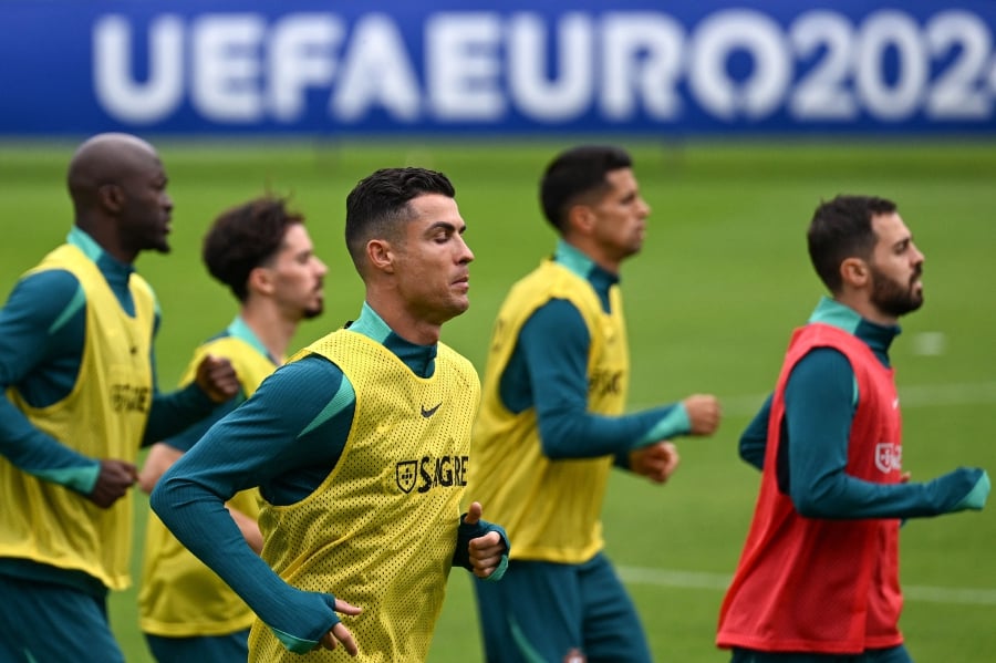 Superstar Portugal striker Cristiano Ronaldo is determined to make more European Championship history this summer. (Photo by PATRICIA DE MELO MOREIRA / AFP)