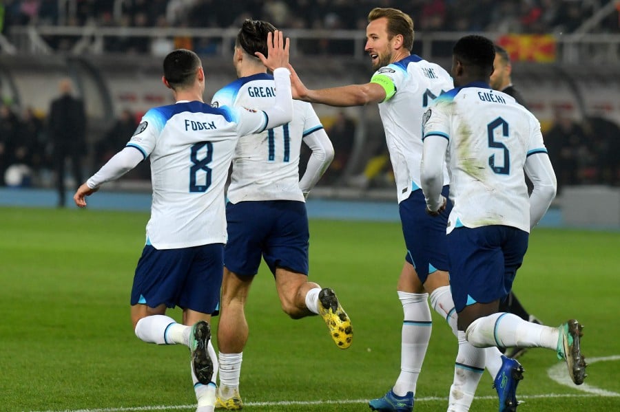 England's striker #20 Harry Kane (2R) celebrates a goal with England's midfielder #08 Phil Foden during the UEFA Euro 2024 group C qualification football match between North Macedonia and England at National Arena "Todor Proeski" in Skopje on November 20, 2023. AFP PIC