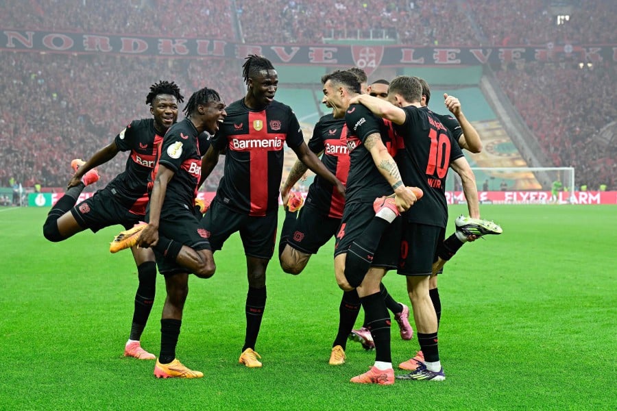 Bayer Leverkusen's Swiss midfielder #34 Granit Xhaka (2nd R) celebrates scoring the opening goal with his teammates during the German Cup (DFB-Pokal) final football match between 1 FC Kaiserslautern and Bayer 04 Leverkusen at the Olympic Stadium in Berlin on May 25, 2024. AFP PIC