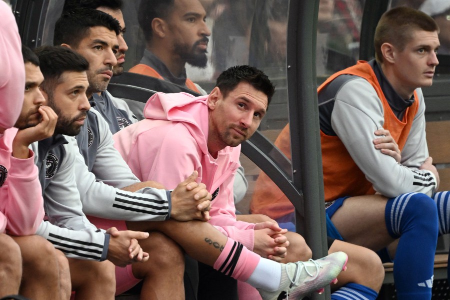 Inter Miami's Argentine forward Lionel Messi (C) sits on the bench during the friendly football match between Hong Kong XI and US Inter Miami CF in Hong Kong on February 4, 2024. Inter Miami were booed off the pitch after their injured superstar Lionel Messi failed to take the field in a pre-season friendly in Hong Kong. AFP PIC