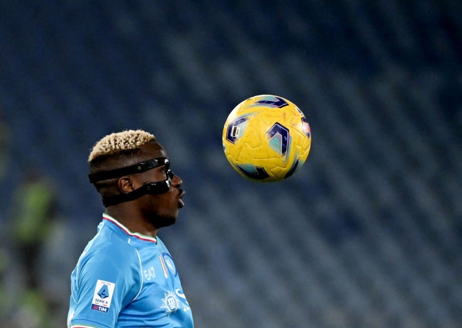 Napoli's Nigerian forward #09 Victor Osimhen eyes the ball during the Italian Serie A football math between Roma and Napoli at the Olympic stadium in Rome on December 23, 2023. AFP PIC