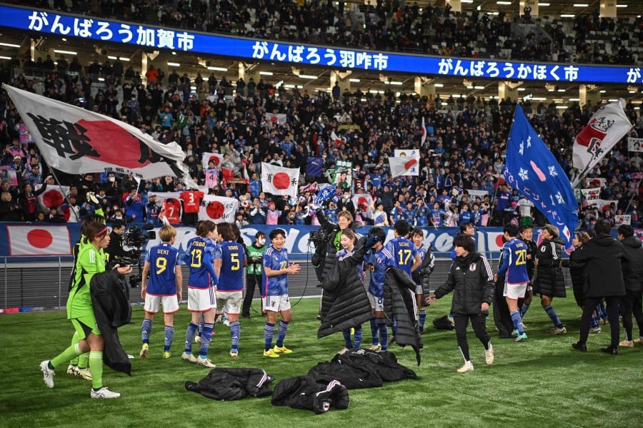 Japan's players celebrate their 2-1 victory after the 2024 Olympic qualifying women's football match between Japan and North Korea at the National Stadium in Tokyo on February 28, 2024. AFP PIC
