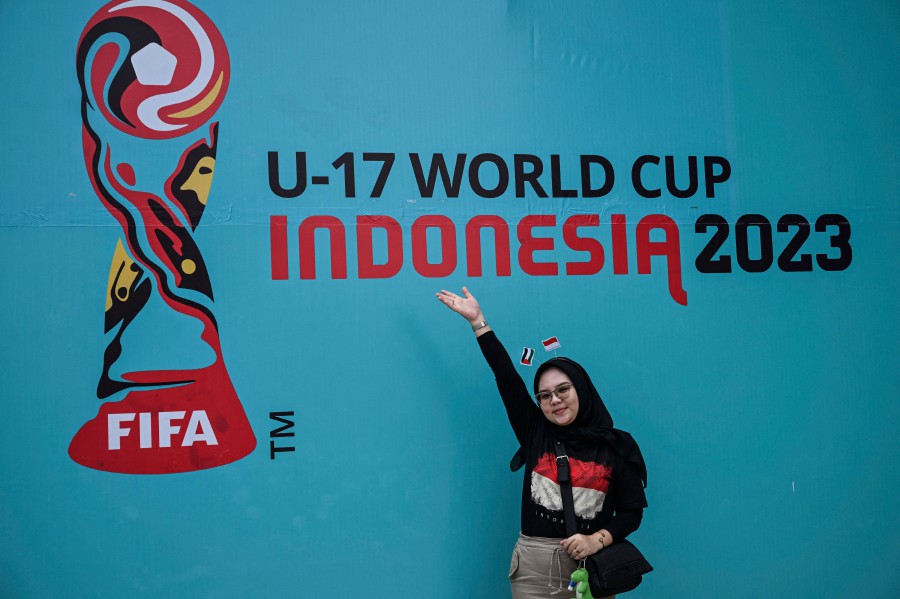 A supporter of Indonesia poses for a picture before the FIFA U-17 World Cup Indonesia 2023 Group A match between Indonesia and Ecuador at the Gelora Bung Tomo Stadium in Surabaya on November 10, 2023. AFP PIC