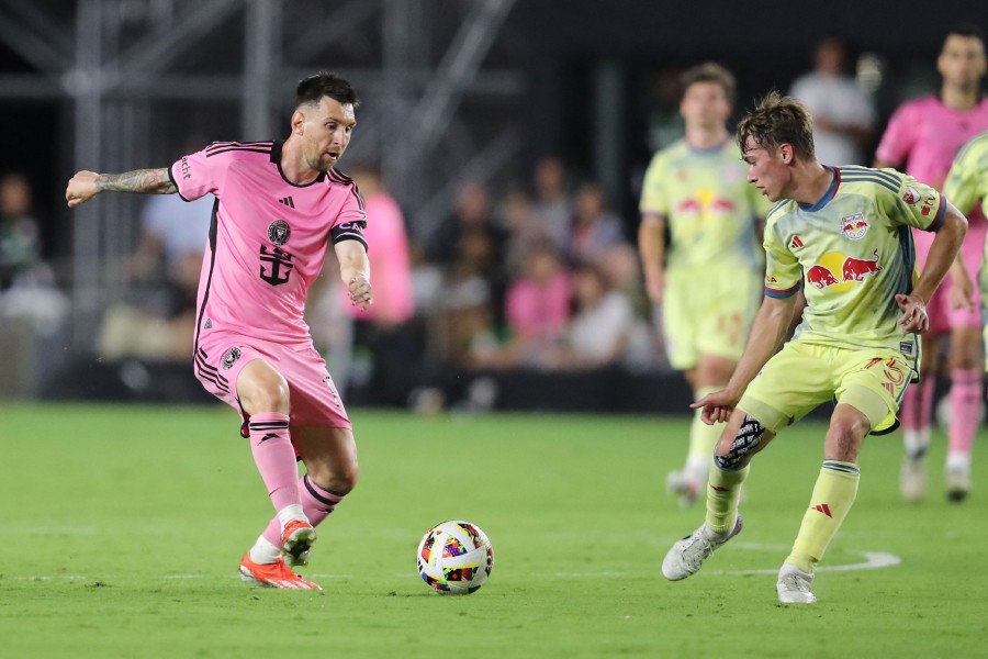 Inter Miami's Argentine forward #10 Lionel Messi fights for the ball with US midfielder #75 Daniel Edelman during the Major League Soccer (MLS) football match between Inter Miami CF and the New York Red Bulls at Chase Stadium in Fort Lauderdale, Florida, on May 4, 2024. AFP PIC