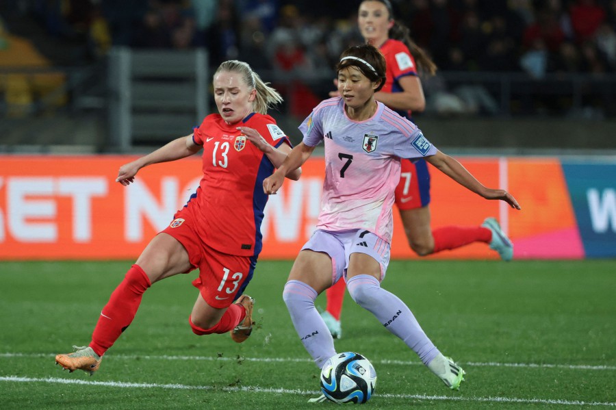 Japan's midfielder #07 Hinata Miyazawa (R) and Norway's midfielder #13 Thea Bjelde fight for the ball during the Australia and New Zealand 2023 Women's World Cup round of 16 football match between Japan and Norway at Wellington Regional Stadium in Wellington on August 5, 2023. -AFP PIC
