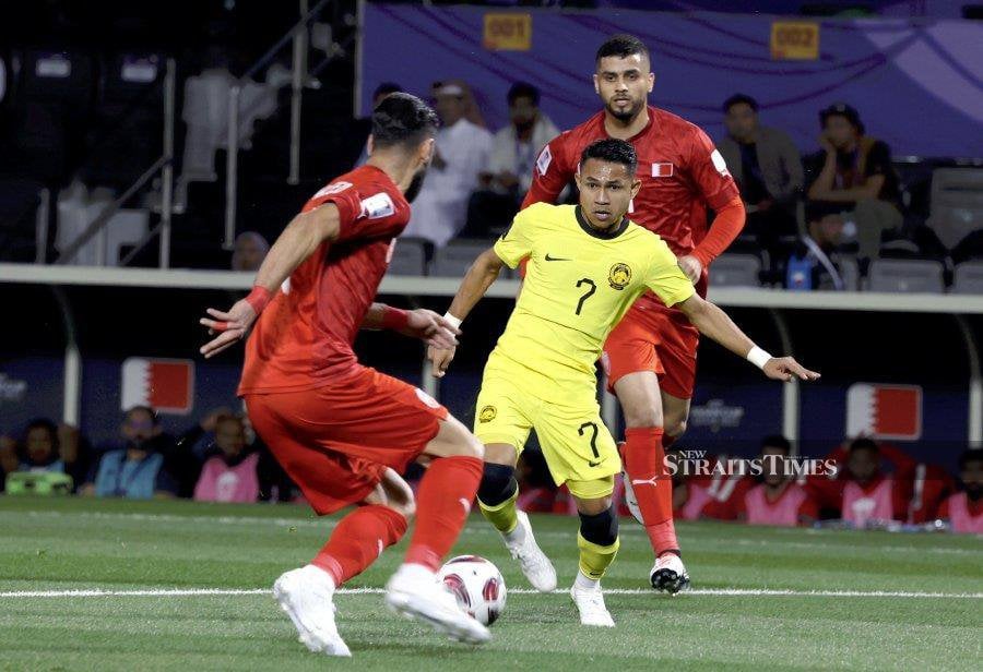 Malaysia’s Faisal Halim (centre) in action against Bahrain in the Asian Cup in Doha, Qatar, on Jan 20. NSTP PIC