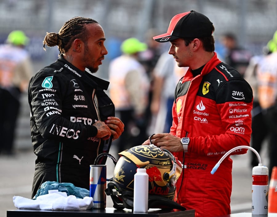 Mercedes' British driver Lewis Hamilton (L) speaks with Ferrari's Monegasque driver Charles Leclerc after the Sprint race at the Circuit of the Americas in Austin, Texas, on October 21, 2023 ahead of the United States Formula One Grand Prix. - AFP PIC