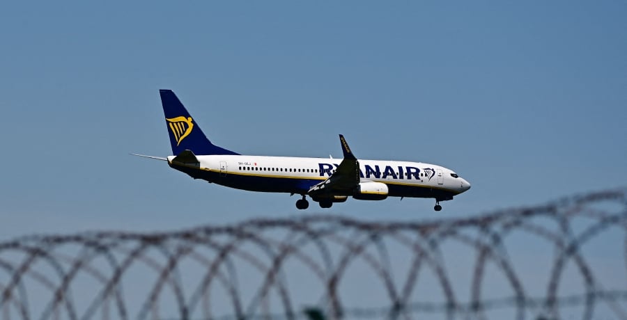 (FILES) In this file photo taken on May 31, 2021 an airplane of Irish airline Ryanair approaches the BER airport near Berlin Schoenefeld. - The US Justice department charged four Belarus officials with air piracy January 20, 2022 for last year's forced diversion of a Ryanair flight in order to arrest a dissident on board. (Photo by Tobias Schwarz / AFP)