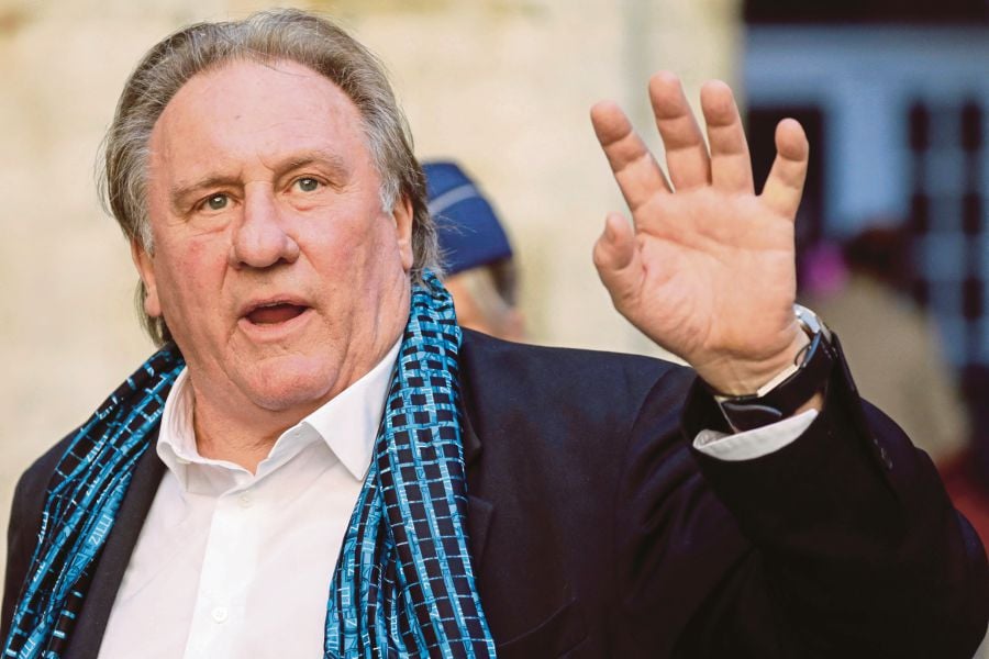 (FILES) French actor Gerard Depardieu waves as he arrives at the Town Hall in Brussels for a ceremony as part of the 'Brussels International Film Festival' (Briff). (Photo by THIERRY ROGE / BELGA / AFP) / Belgium OUT