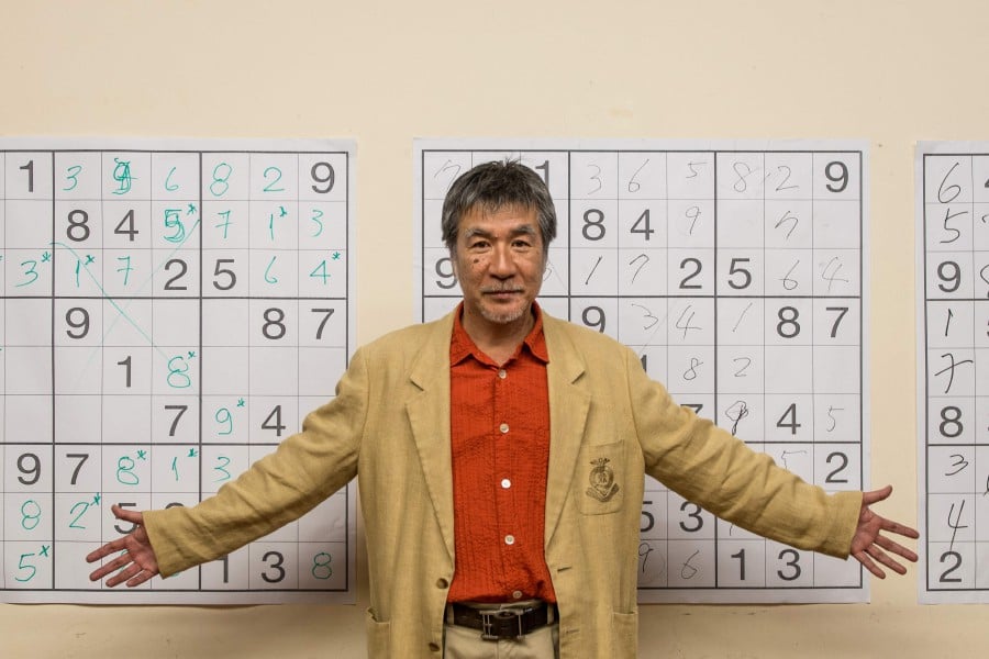 (FILES) The man dubbed the "father of Sudoku" for his role in popularising the numerical brainteaser loved by millions, has died of cancer at 69, his Japanese publisher has announced. In a notice posted August 16, 2021, Nikoli said Maki Kaji died at home on August 10 after battling cancer, and a memorial service would be held at a later date. (Photo by Yasuyoshi CHIBA / AFP)