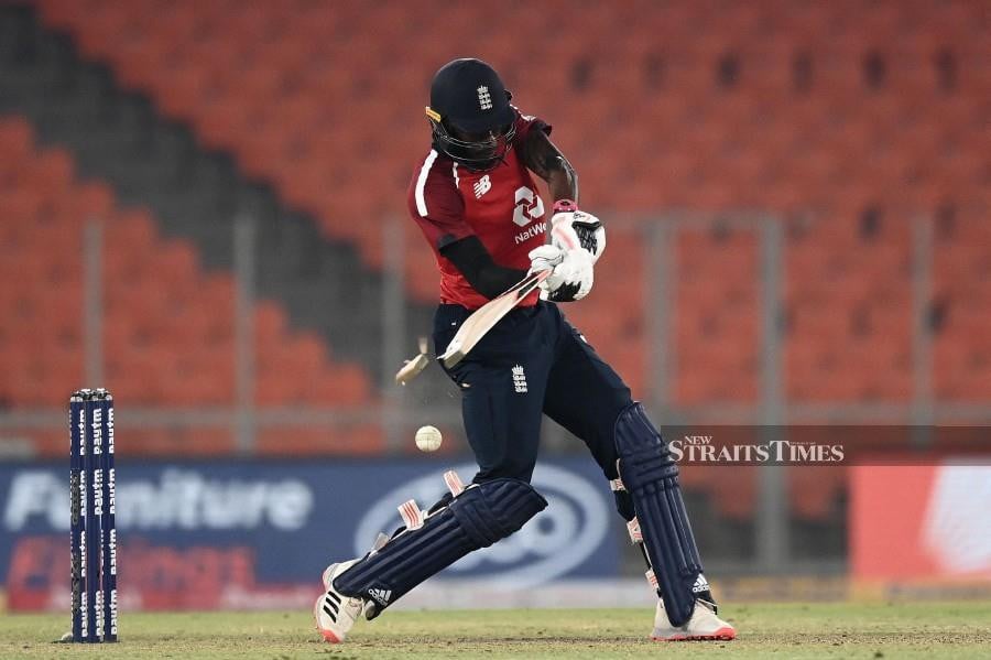 England's Jofra Archer plays a shot to break his bat during the fourth Twenty20 international cricket match between India and England at the Narendra Modi Stadium in Motera on March 18, 2021. Archer has warned he may struggle to cope with yet more injury woe, saying: "I don't know if I have another stop-start year in me", he told the 4Cast's Athlete's Voice podcast on April 30, 2024. AFP FILE PIC