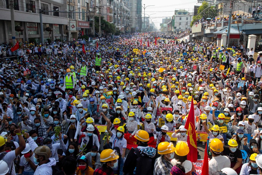 (FILES) Protesters take part in a demonstration against the military coup in Mandalay. (Photo by AFP)