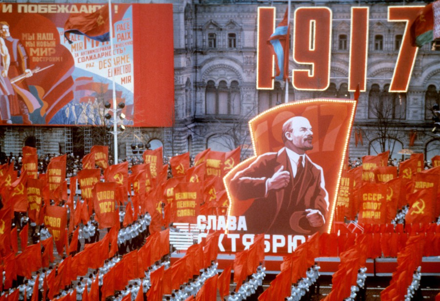 People take red flags and portrait of Vladimir Ilyich Lenin during celebration of the 68th anniversary of the Great October Socialist Revolution in the Red Square, Moscow, Russia, on November 7, 1985. AFP FILE PIC