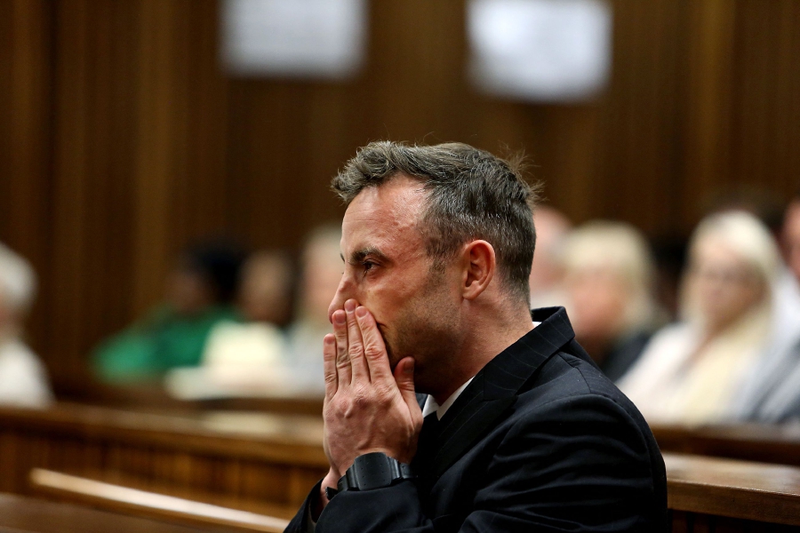 (FILES) South African Paralympian Oscar Pistorius gestures during the third day of his hearing at the Pretoria High Court for sentencing procedures in his murder trial in Pretoria. (Photo by Alon Skuy / POOL / AFP)