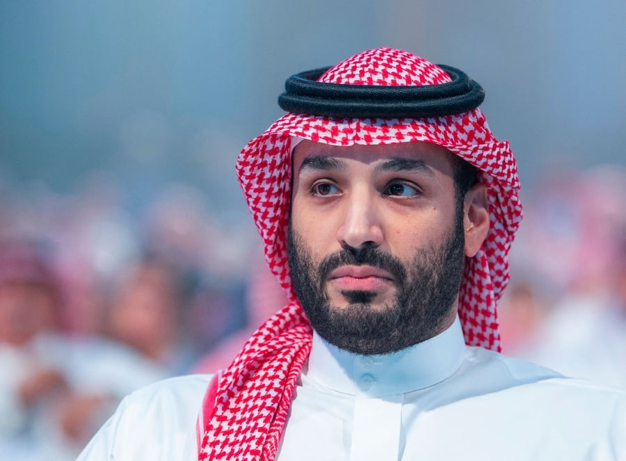 (FILES) In this file handout photo provided by the Saudi Royal Palace on October 26, 2021 shows Saudi Crown Prince Mohammed bin Salman attending a session at the annual Future Investment Initiative (FII) conference in the Saudi capital Riyadh. - (Photo by Bandar AL-JALOUD / Saudi Royal Palace / AFP) 