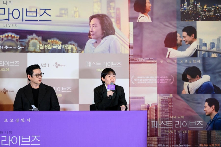 (FILES) (L-R) German-South Korean actor Teo Yoo and South Korean-Canadian director, playwright, and screenwriter Celine Song attend a press conference after a screening of her film, Past Lives, in Seoul. (Photo by ANTHONY WALLACE / AFP)