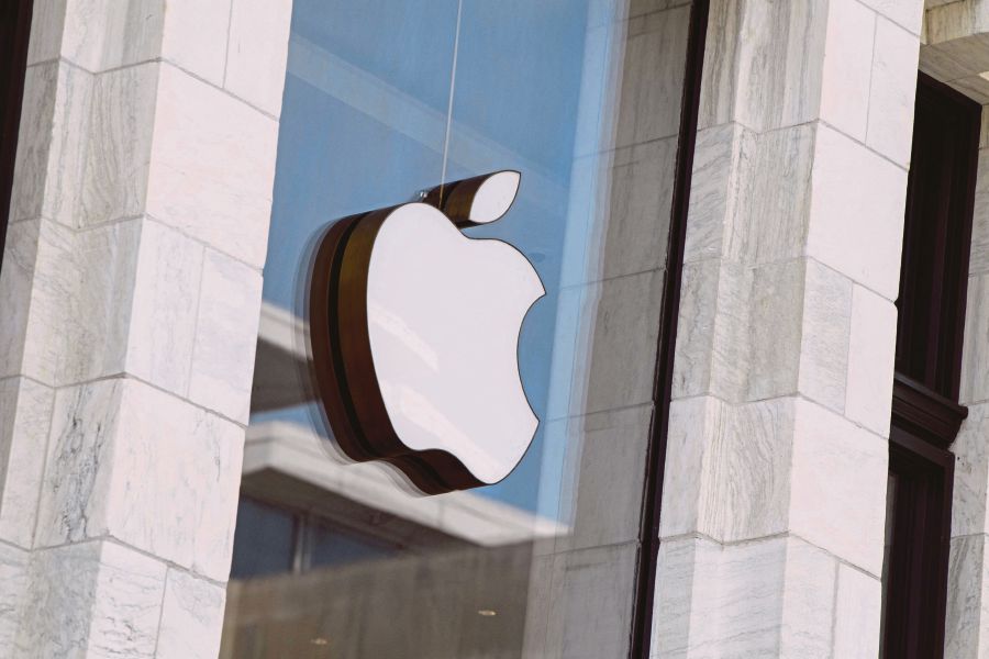 The Apple logo is seen at the entrance of an Apple store in Washington, DC. - AFP PIC