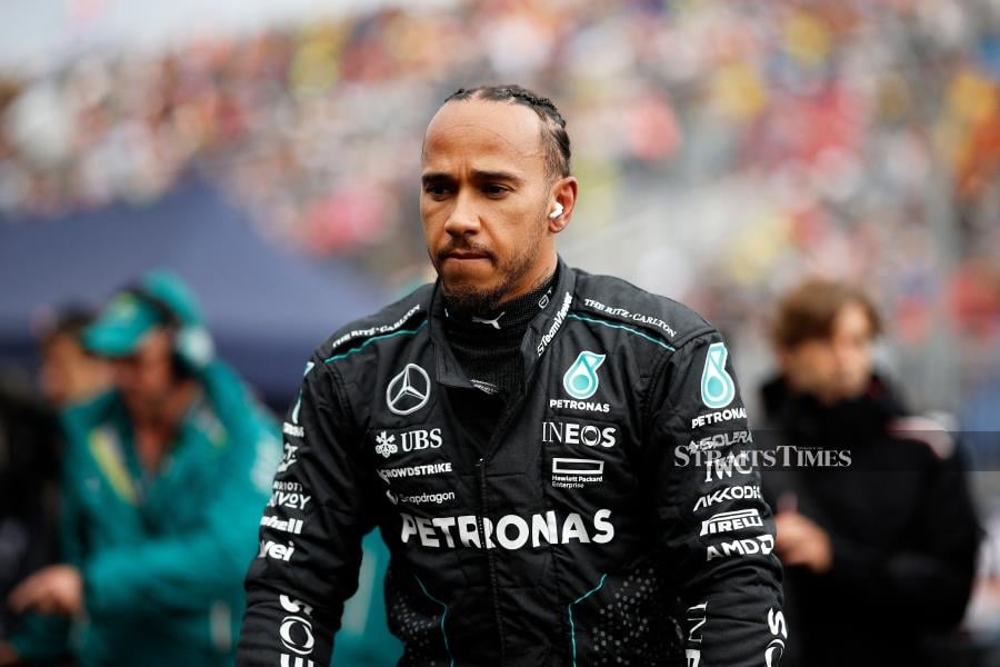 Mercedes; Lewis Hamilton looks on, on the grid prior to the Canadian Grand Prix at Circuit Gilles Villeneuve in Montreal, Quebec, on Sunday. AFP PIC