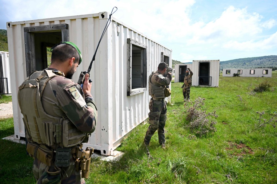 Soldiers from the French Foreign Legion (Legion etrangere) take part in a training exercise on military grounds in Canjuers, southern France, on Tuesday (May 28), before their deployment to Paris to ensure security missions during the Paris 2024 Olympic Games. The legendary French Foreign Legion is preparing for security duty in the French capital during this summer�s Olympic Games, a far cry from the group's previous deployments. — AFP