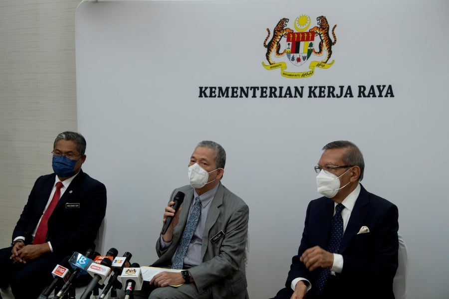 Senior Works Minister Datuk Seri Fadillah Yusof (centre) speaking to press during a special media conference in Kuala Lumpur. - BERNAMA PIC