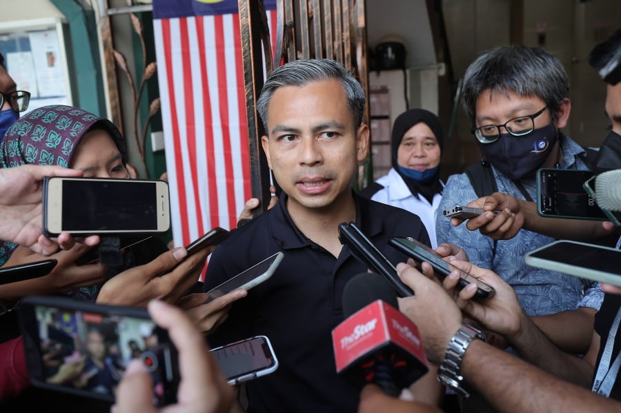 Digital Communications Minister Fahmi Fadzil has urged police and the Election Commission to investigate claims by Kedah Perikatan Nasional chief Datuk Seri Sanusi Md Nor that voters were being paid to return to vote in the Padang Serai election. - Bernama pic