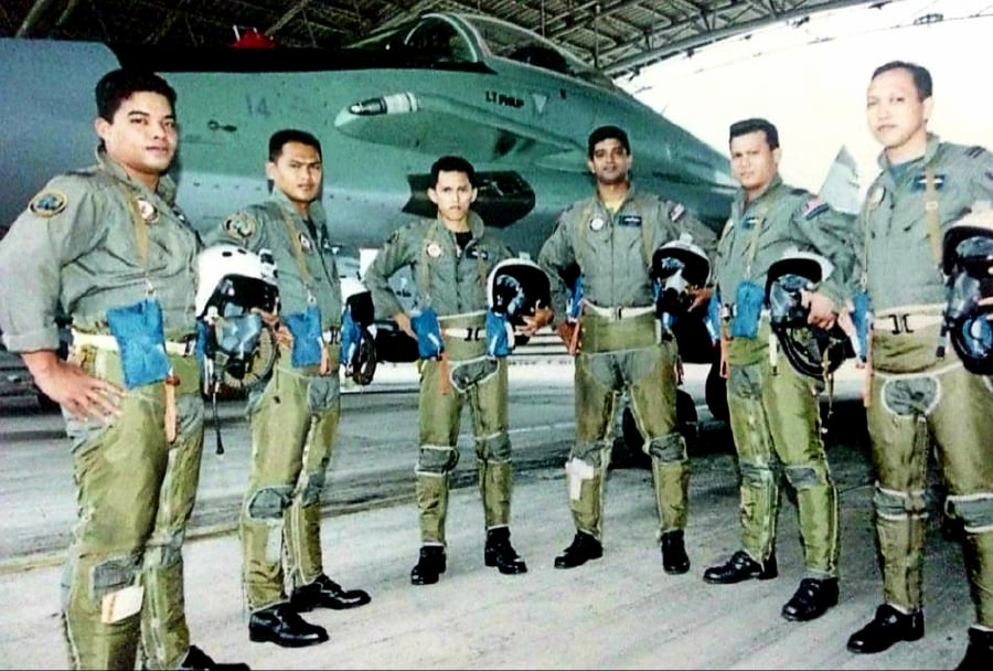 (From left) Capt Roshaidi Kamaruddin ‘G-Mon, Capt Ed Sam Ribut Tuah, Lt Hisham Che Halid ‘Stitch’, Capt Sebastian William ‘Arrow’, Major Fajim Juffa Mustafa Kamal ‘Pejump’, and Capt Razali Ahmad Jumali ‘Vendor’ at the MiG-29N squadron at RMAF Kuantan base in 2004. - Pic courtesy of Col Sebastian William 'Arrow'