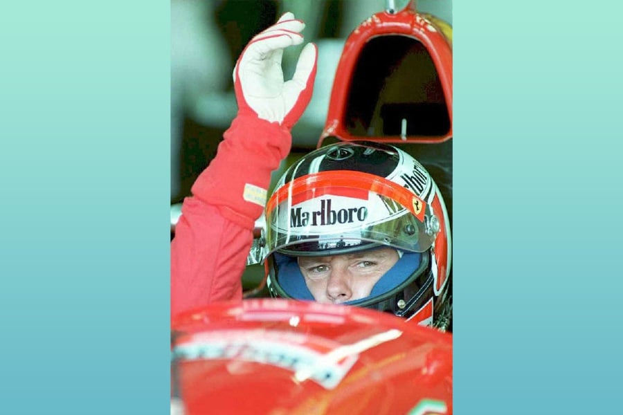 (FILES) Gerhard Berger of the Scuderia Ferrari team signals he is ready to drive in the free practice at the Circuit Gilles-Villeneuve in Montreal on June 9, 1995. A Ferrari stolen from Austrian former racing driver Gerhard Berger after the San Marino Grand Prix in 1995 has been recovered, Britain's Metropolitan Police said on March 4, 2024. - AFP pic