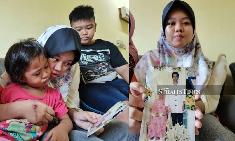 (Right) Nursazzey Shazmika shows a picture of her parents. (Left) Nursazzey Shazmika with Mohd Irfan Itihsyam Mazlan (right) and siblings look at a picture of their parents. -NSTP/YUN MIKAIL-