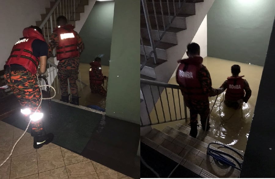 Two people almost drowned when they were caught in a rapidly flooding underground parking lot of a hotel in Section 13 here while trying to move a vehicle.  - Pic courtesy of Fire and Rescue Depart