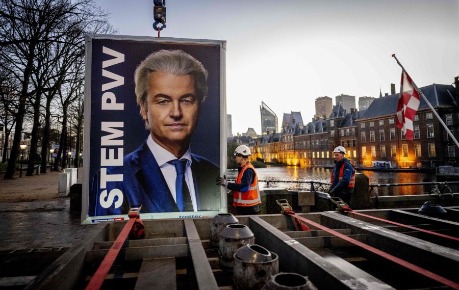 Workers prepare to remove an election sign of Party for Freedom (PVV) leader Geert Wilders near the Binnenhof, a day after the Netherlands general elections, in the Hague. Far-right firebrand Geert Wilders faced an uphill struggle to woo rivals for a coalition government after a "monster victory" in Dutch elections that shook the Netherlands and Europe. - AFP pic