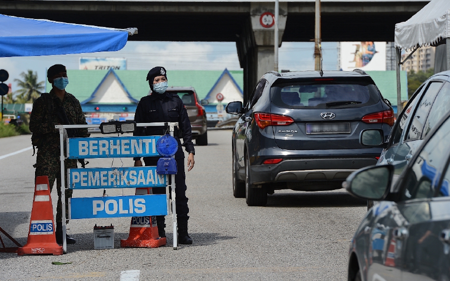 Malaysians should remain cautious and comply with the standard operating procedures (SOP) set by the government, despite the nod given to inter-state and inter-district travel. - Bernama pic