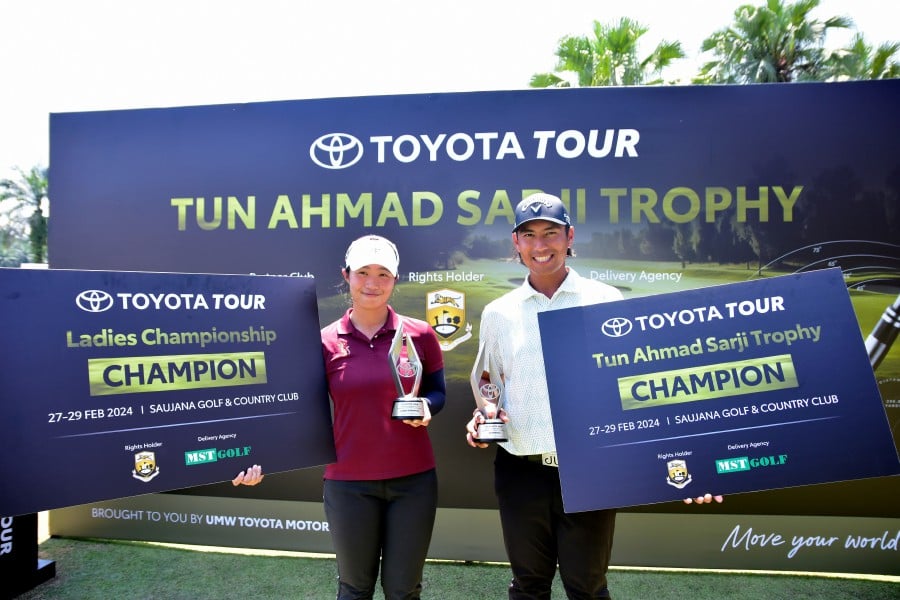 Galven Green (right) shrugged off a disastrous start to emerge champion of the Toyota Tour’s season-opening RM210,000 Tun Ahmad Sarji Trophy at the Saujana Golf and Country Club today. BERNAMA PIC
