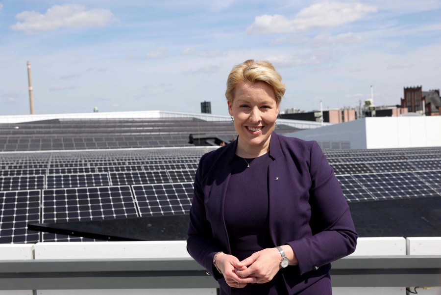 Berlin's state economy minister and former mayor of Berlin Franziska Giffey poses for a photo in front of solar panels during an event to promote solar energy, today (May 8) in Berlin, one day after an attacker hit her in the head with a bag. — AFP