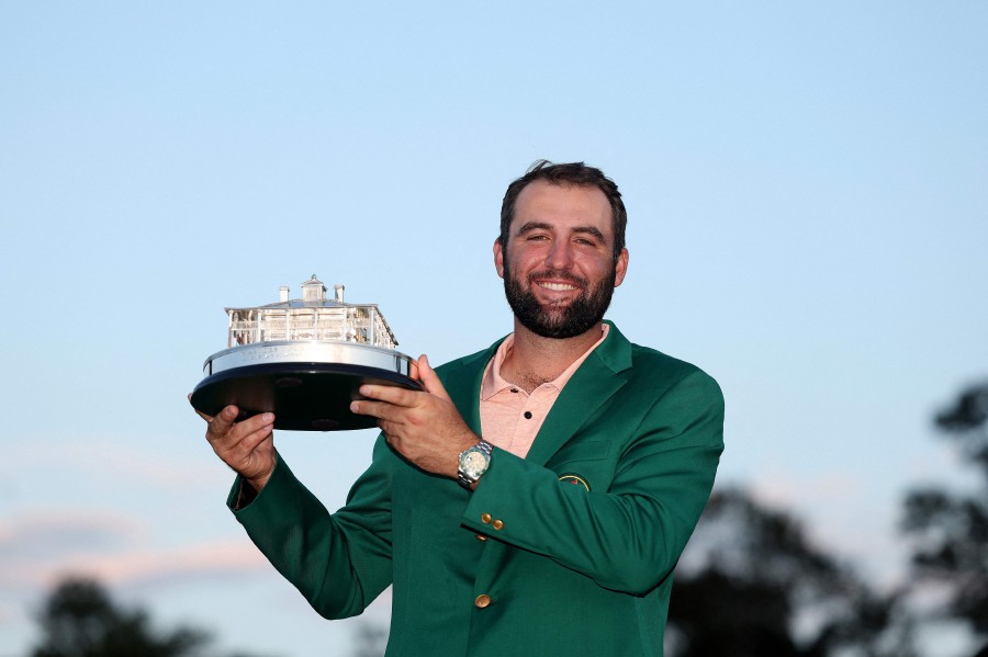 Scottie Scheffler of the United States poses with the Masters trophy after winning the 2024 Masters Tournament at Augusta National Golf Club on April 14, 2024 in Augusta, Georgia. - AFP pic