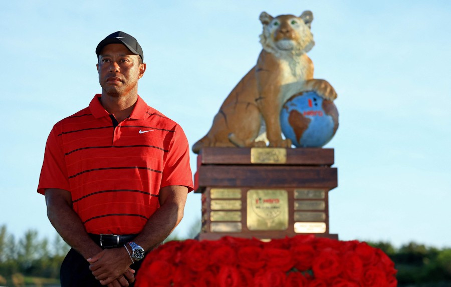 Tournament host Tiger Woods poses with the trophy during the final round of the Hero World Challenge at Albany Golf Course on December 03, 2023 in Nassau. AFP PIC