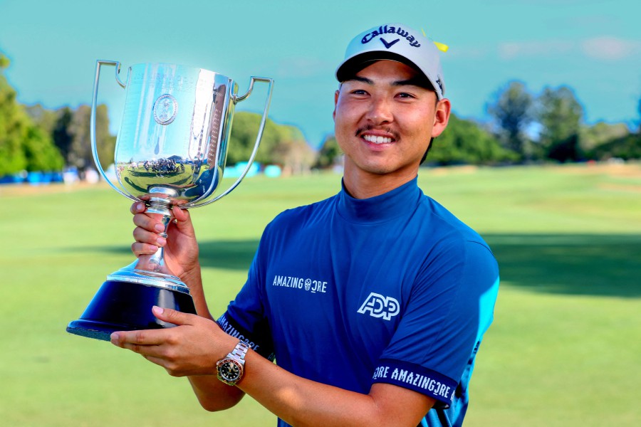 Min Woo Lee of Australia poses with his trophy following victory on the final day of the Australian PGA Championship at the Royal Queensland Golf Club in Brisbane on November 26, 2023. AFP PIC