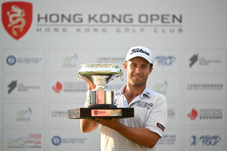 New Zealand's Ben Campbell celebrates with the winner's trophy after his victory on the final day of the Hong Kong Open at Fanling golf club in Hong Kong on November 12, 2023. AFP PIC