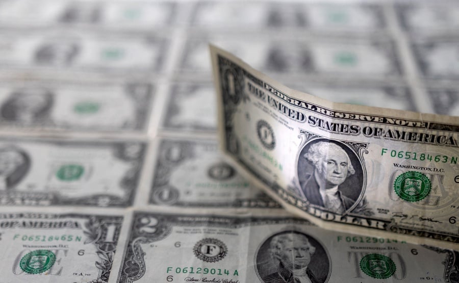 U.S. dollar banknotes are displayed in this illustration taken. REUTERS/Dado Ruvic/Illustration