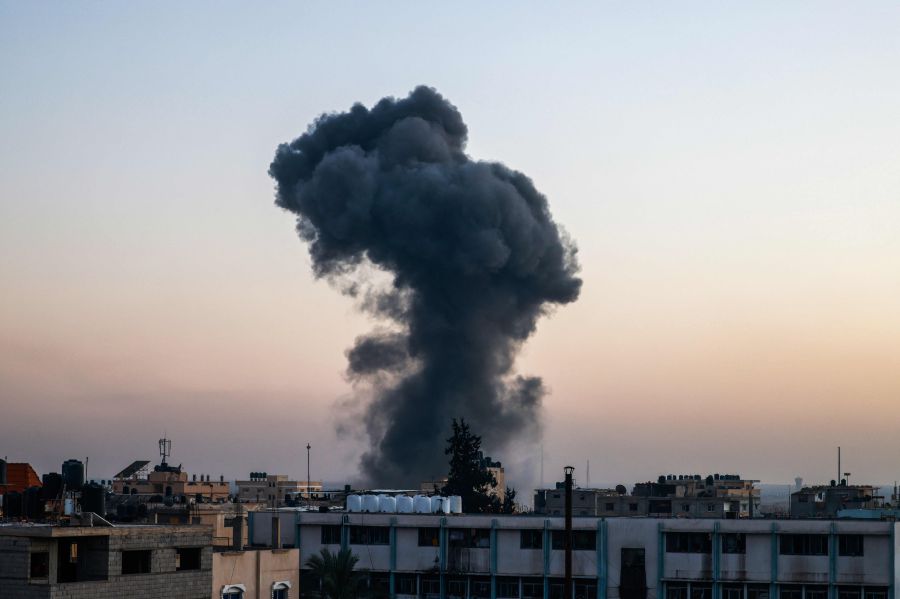 A billow of smoke rises over buildings after an Israeli strike in Rafah, southern Gaza Strip, amid the ongoing conflict between Israel and the Palestinian fighters group Hamas. - AFP pic
