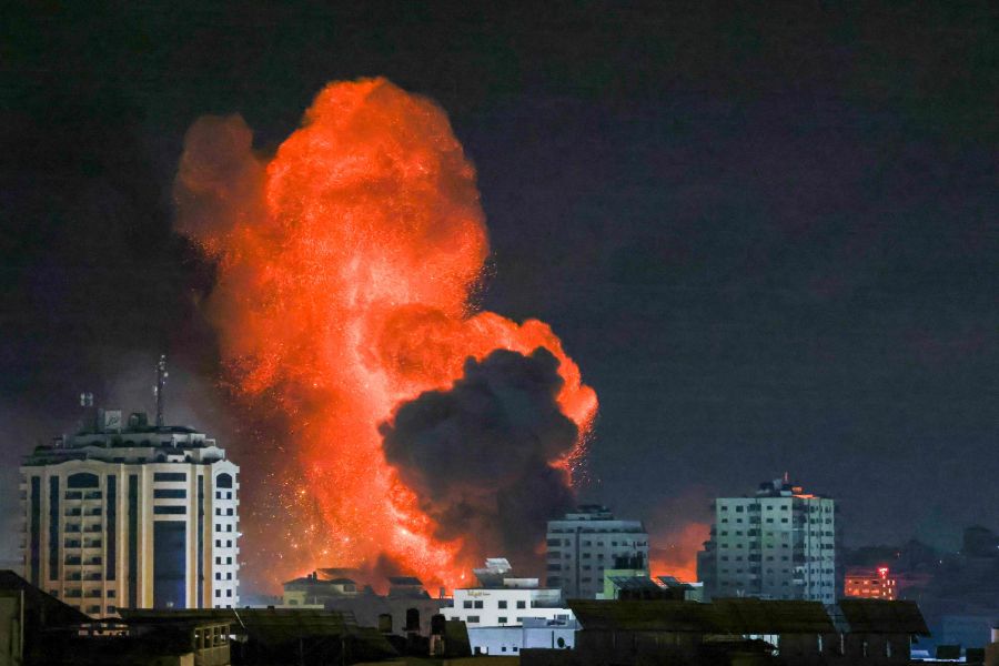 A fireball erupts from an Israeli airstrike in Gaza City. - They were not Palestinian soldiers fighting Israeli soldiers, but unarmed, helpless civilians. The killings and persecution continue with the West reducing the persecuted Palestinians to its limited vocabulary: “terrorists”. - AFP pic