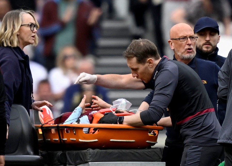 West Ham United's George Earthy is stretchered off after sustaining an injury. - Reuters pic