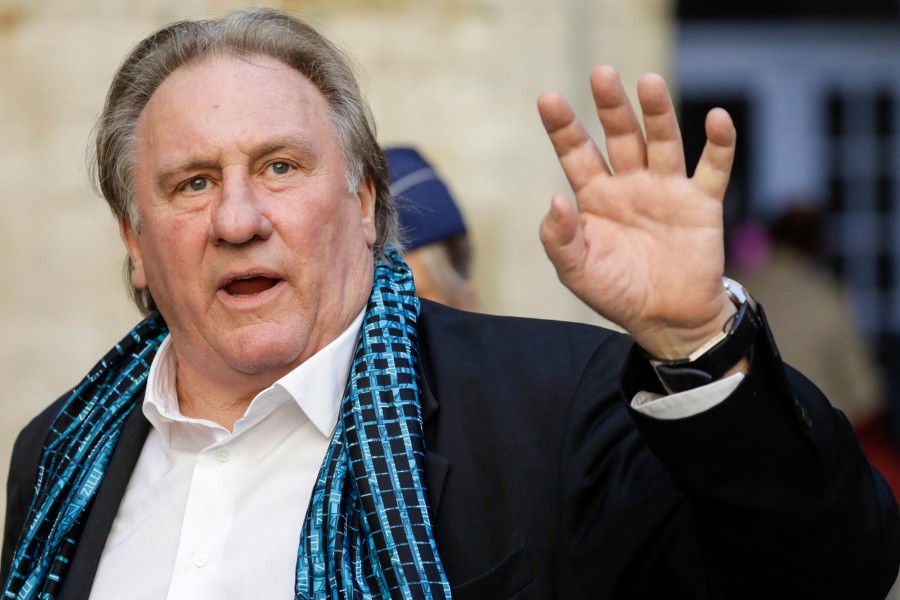 French actor Gerard Depardieu waves as he arrives at the Town Hall in Brussels for a ceremony as part of the 'Brussels International Film Festival' (Briff). Nearly 60 French actors and other prominent figures have denounced the "lynching" of disgraced cinema legend Gerard Depardieu, who is charged with rape and facing a litany of sexual assault claims. "Gerard Depardieu is probably the greatest of all actors," said an open letter published in French newspaper Le Figaro late on December 25, 2023, Christmas Day. - AFP file pic