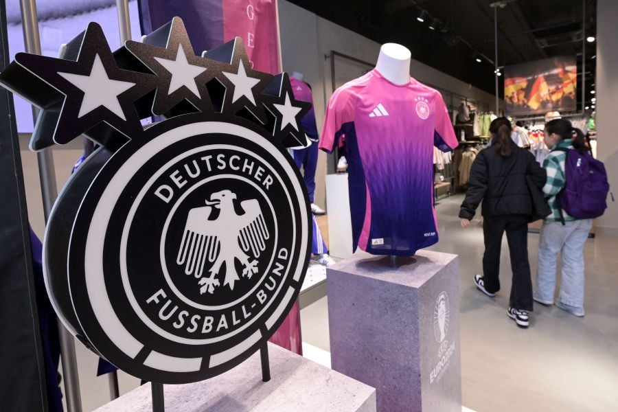 Germany's national team jerseys made by Adidas are pictured in official store in Frankfurt am Main, western Germany ahead German national football team international friendly football matches against France and the Netherlands. The German national football team's decision to drop Adidas as its kit supplier sparked dismay in Berlin on March 22, 2024, with the economy minister blasting the switch to US sportswear giant Nike as a lack of "patriotism". - AFP pic