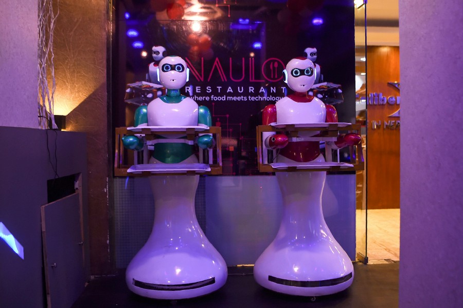 In this picture taken on October 23, 2018, Nepali-made robot waiters are pictured at Naulo restaurant in Kathmandu. - "Please enjoy your meal," says Nepal's first robot waiter, Ginger, as she delivers a plate of steaming dumplings to a table of hungry customers. The poor Himalayan nation is better known for its soaring mountain peaks than technological prowess, but a group of self-taught young innovators are seeking to change that. AFP 