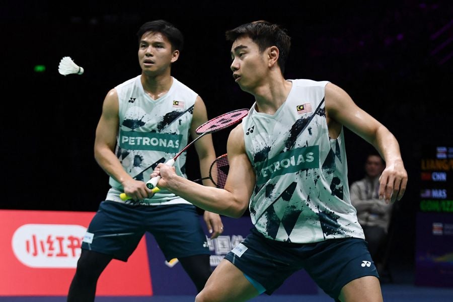 Goh Sze Fei (right) and Nur Izzuddin play a point during their men’s doubles final match against China’s Liang Weikeng and Wang Chang at the Badminton Asia Championships in Ningbo, in eastern China's Zhejiang province on April 14, 2024. - AFP pic