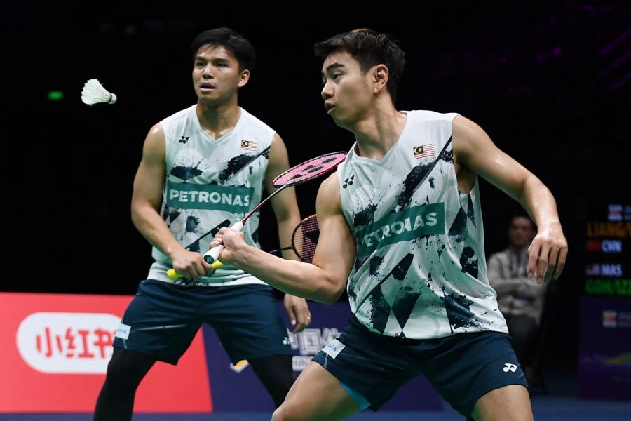 Goh Sze Fei (R) and Nur Izzuddin Rumsani (L) are now ranked at No.15 in the latest world rankings. - AFP PIC