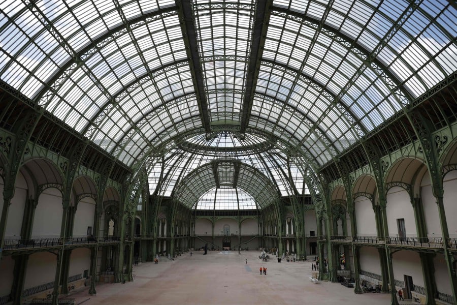 A photo shows an interior view of the Grand Palais during the visit of French President Emmanuel Macron, 100 days ahead of the Paris 2024 Olympic Games in Paris, on April 15, 2024. Le Grand Palais will host the fencing and taekwondo competition events during the Paris 2024 Olympic Games. - AFP pic
