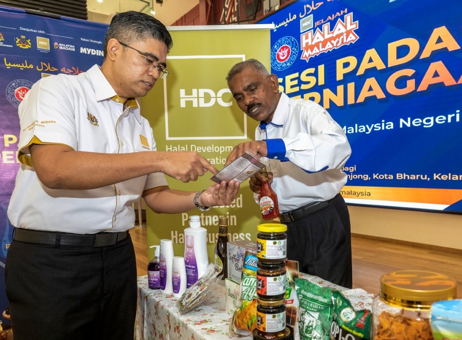 Chief executive officer Hairol Ariffein Sahari (Left) said Malaysia’s halal exports reached RM59 billion last year, which was 63 per cent higher than the 2021 achievement of RM30.3 billion. - Bernama pic