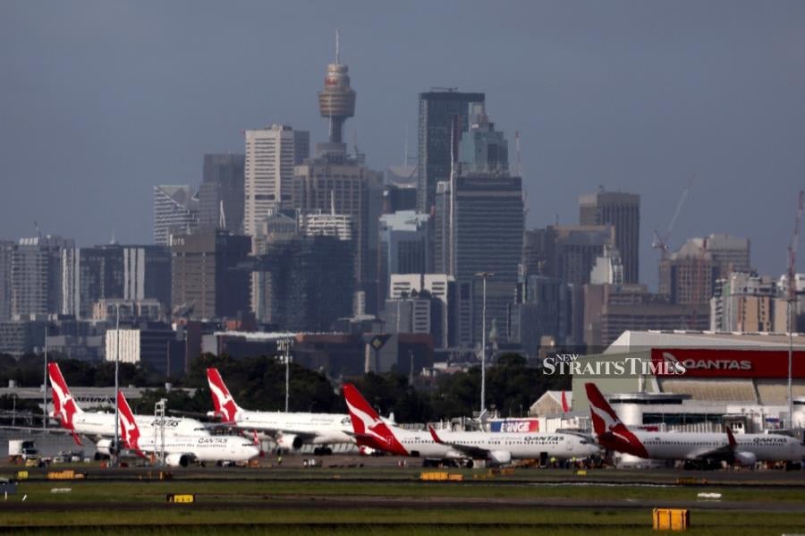 Aircraft parked at the Sydney domestic airport. (Photo by DAVID GRAY / AFP)