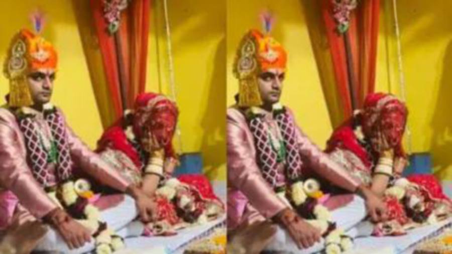 According to Indian cable television station Odishatv, the bride, wearing a red saree, is seen dozing off during the wedding ritual, seated next to the groom. - Pic credit odishatv.in